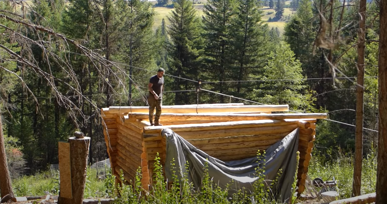 log cabin build last two logs