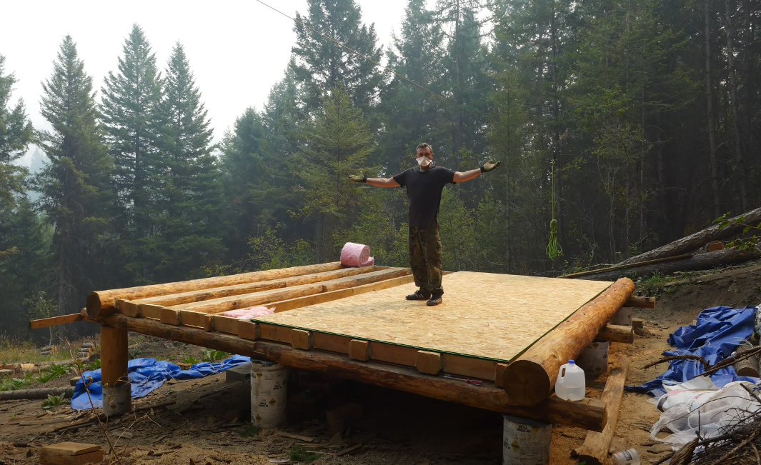 log cabin building the floor