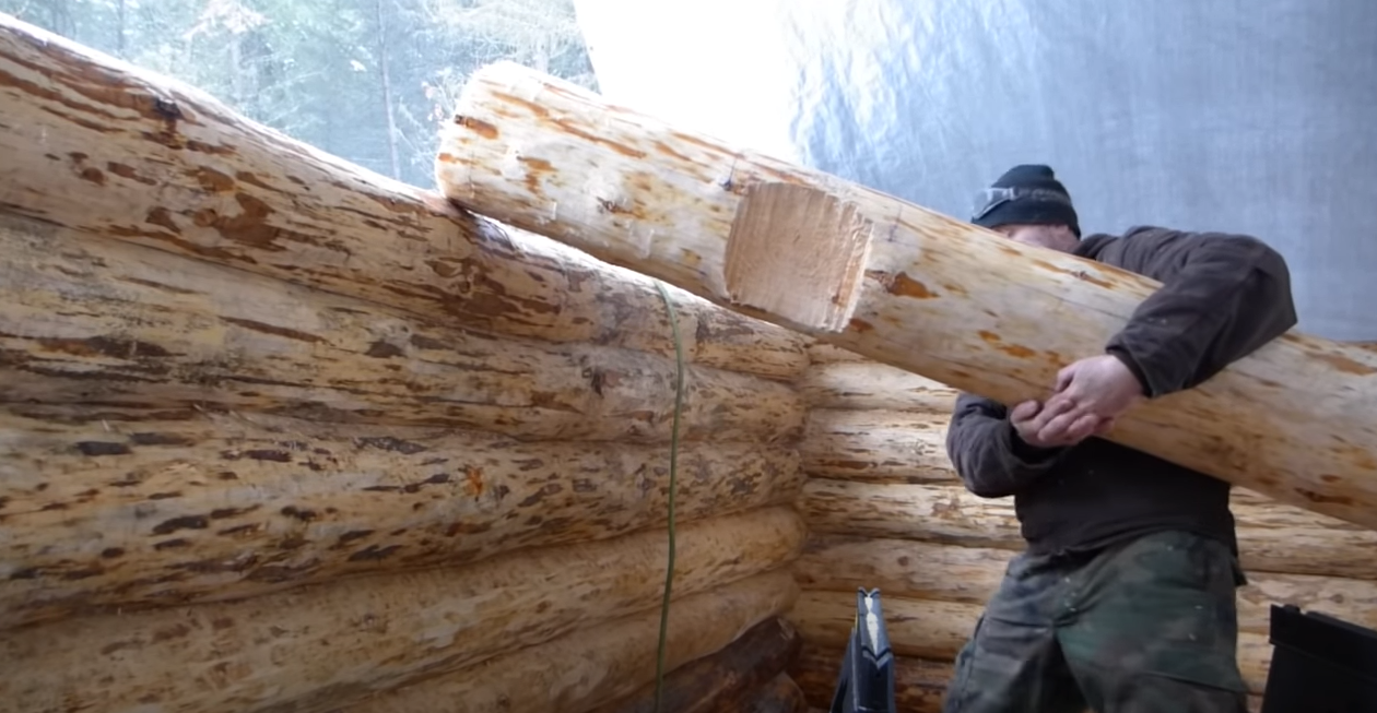 Snow and moving logs by hand